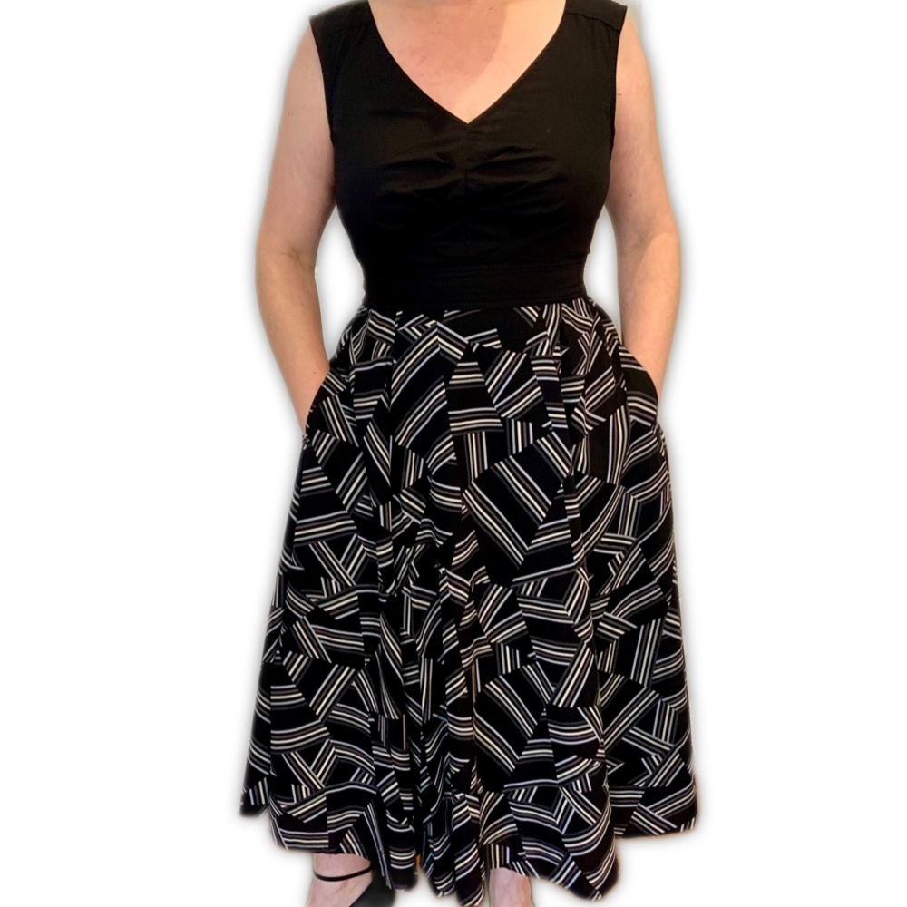 Eshakti maxi dress with black sleeveless bodice and full geometric print skirt